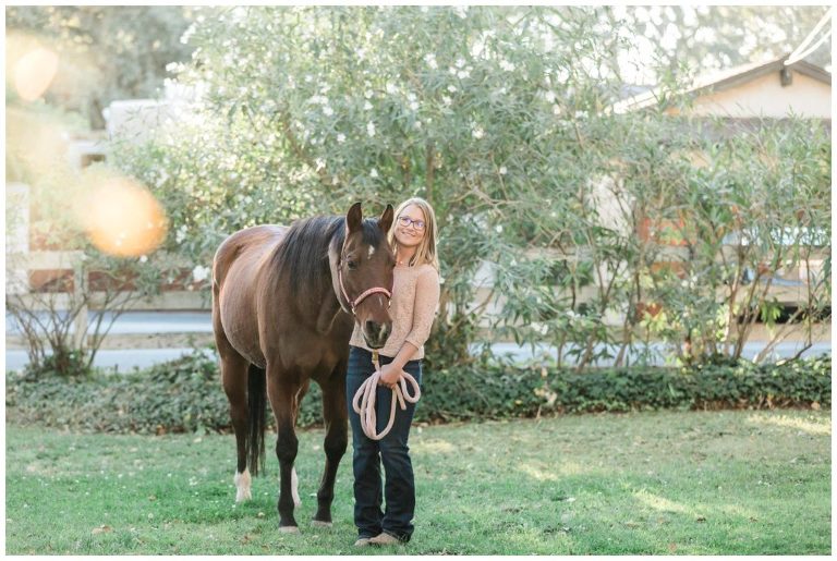 Girl hugging horse by Elizabeth Hay Photography