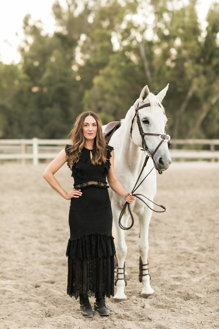 Grey Show jumping mare and woman in black dress at Oak Park Equestrian by Elizabeth Hay Photography