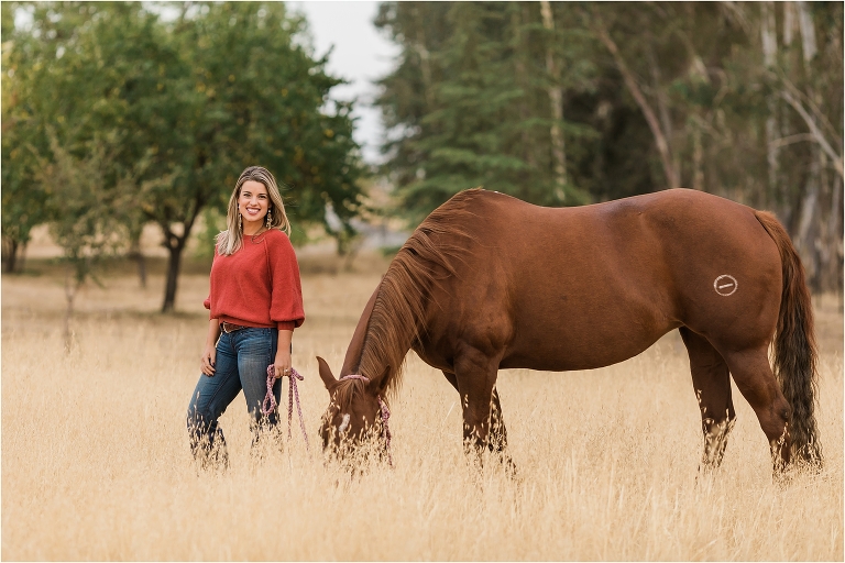 western mare and girl in tall golden field by Elizabeth Hay Photography