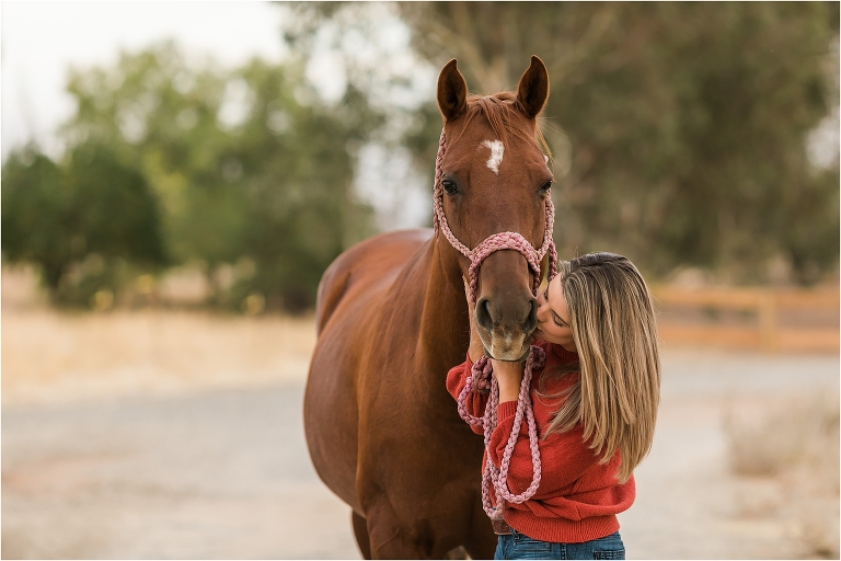 girl kissing her mare on an equine photography session by Elizabeth Hay Photography in California