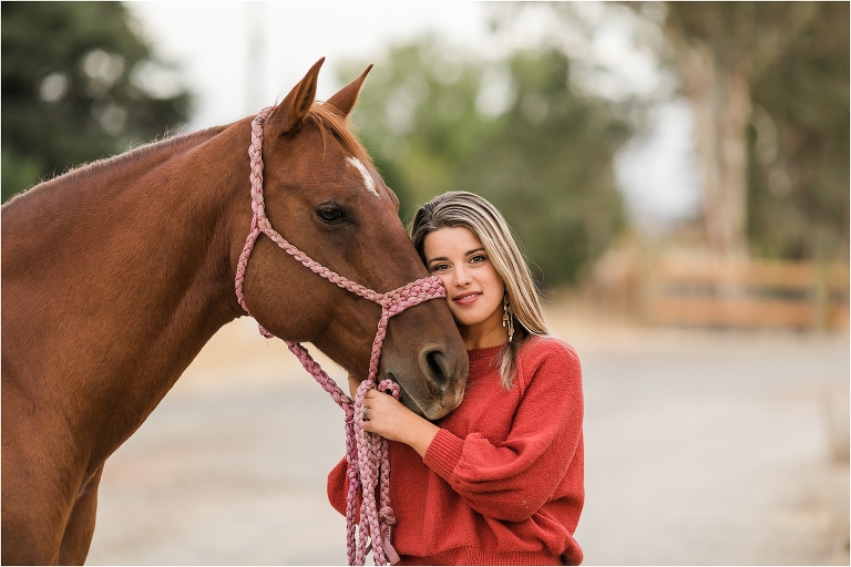 girl resting her cheek on her mare's muzzle by California Equine Photographer Elizabeth Hay Photography