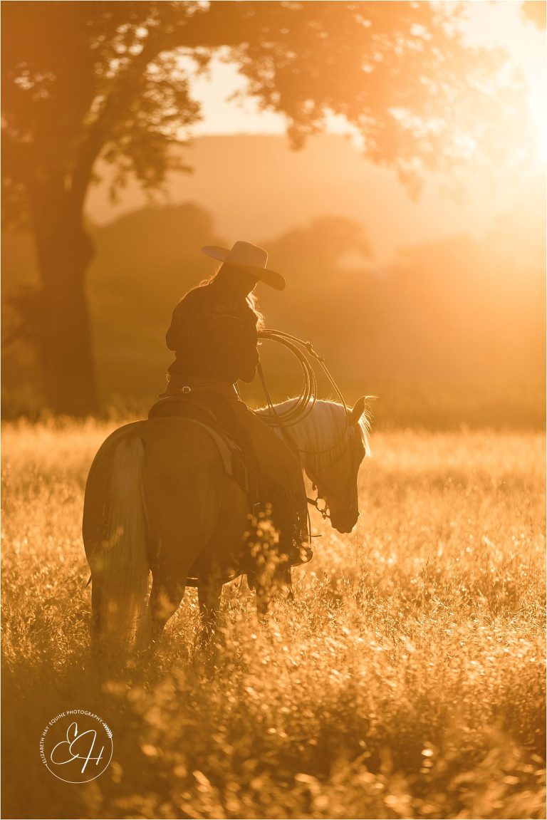 cowgirl riding her palomino gelding at an equine photography workshop in California 
