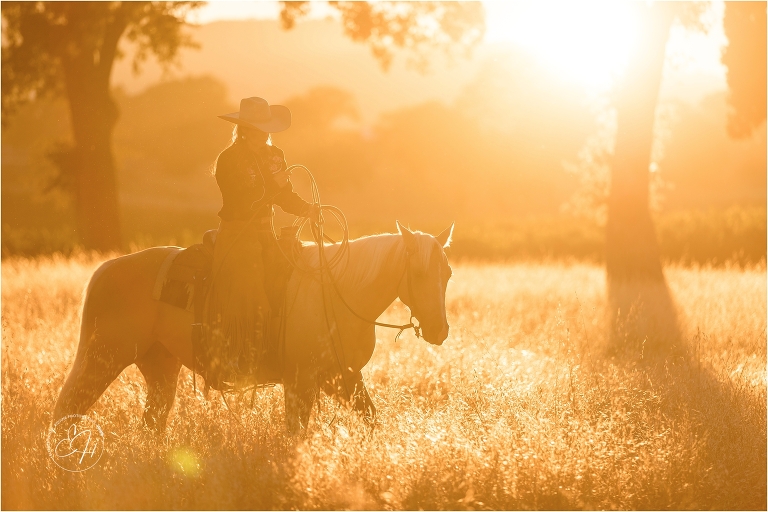 California cowgirl riding a palomino horse at an equine photography workshop in California 
