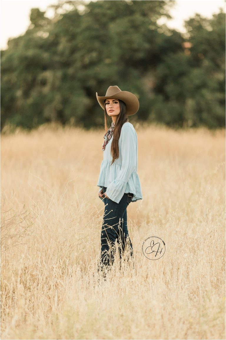 western fashion cowgirl wearing Kimes Ranch jeans and cowboy hat shot by California Equine Photographer Elizabeth Hay Photography