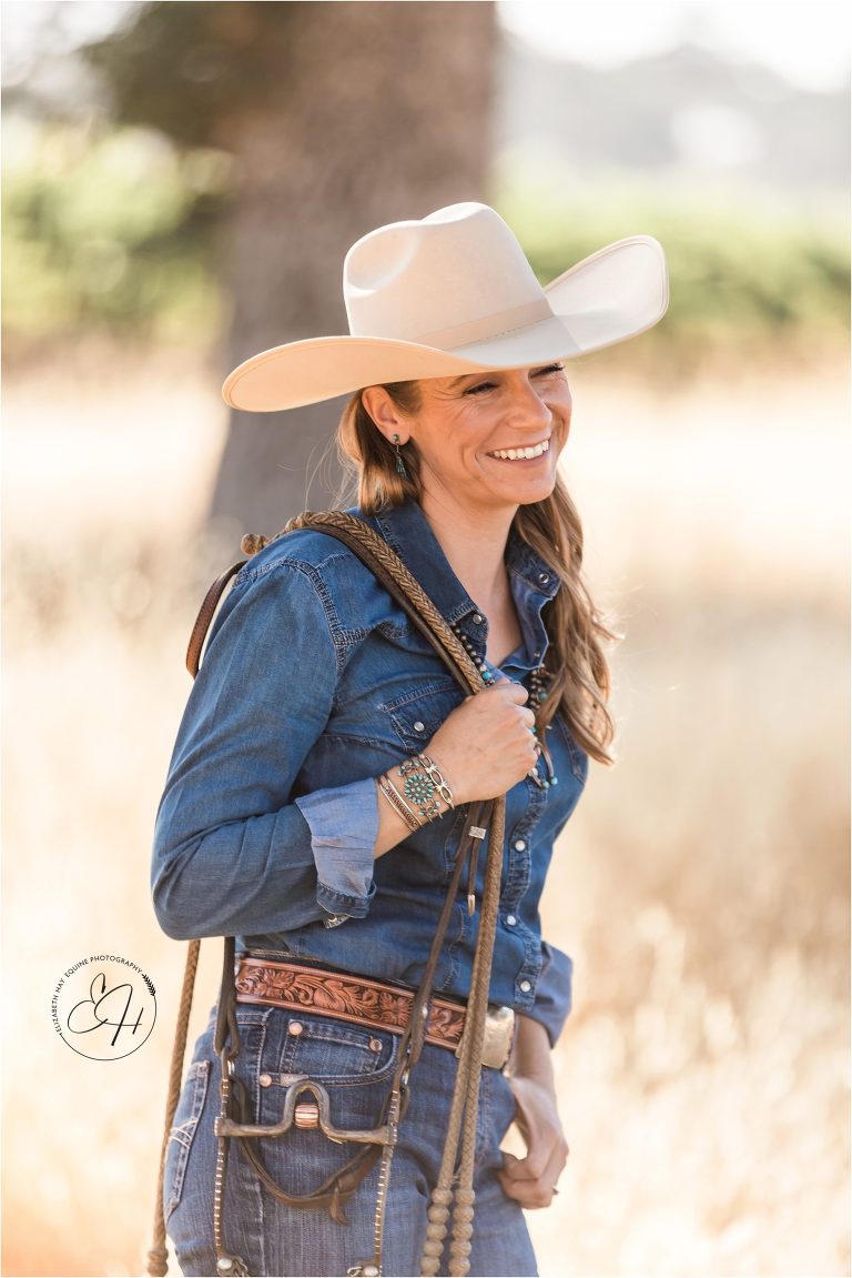 American cowgirl holding a horse headstall photographed by California Equine Photographer Elizabeth Hay Photography