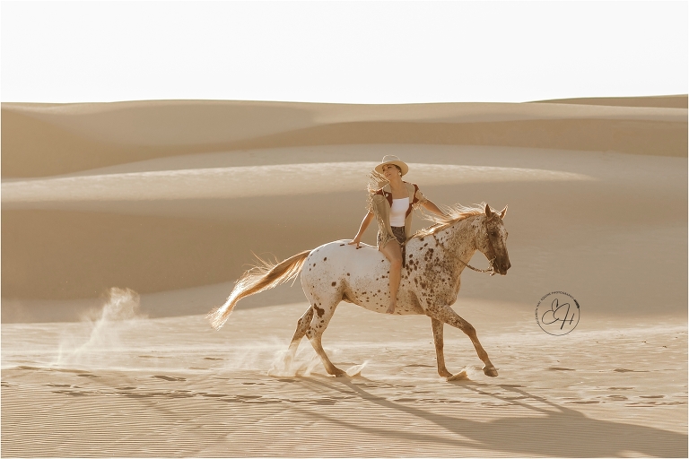 Woman and Appaloosa horse at the Pismo Beach Dunes by Elizabeth Hay Photography