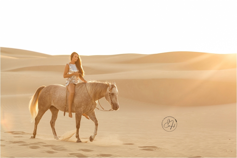 Woman and grey gelding at the Pismo Beach Dunes by Elizabeth Hay Photography
