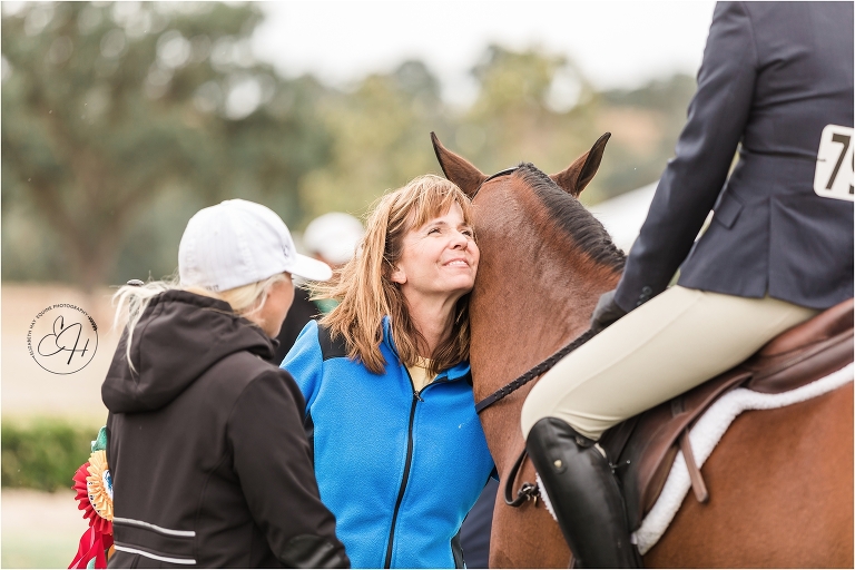horse show mom congratulating winner at horse show