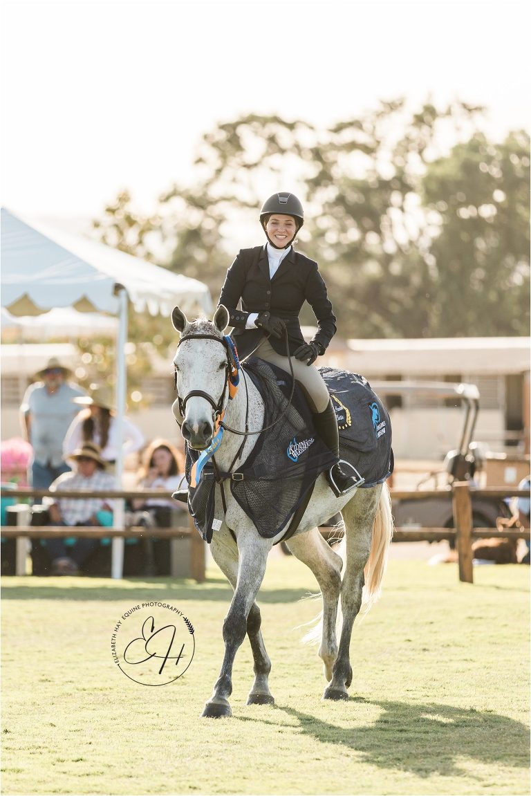 hunter rider smiling after winning round by Elizabeth Hay Photography