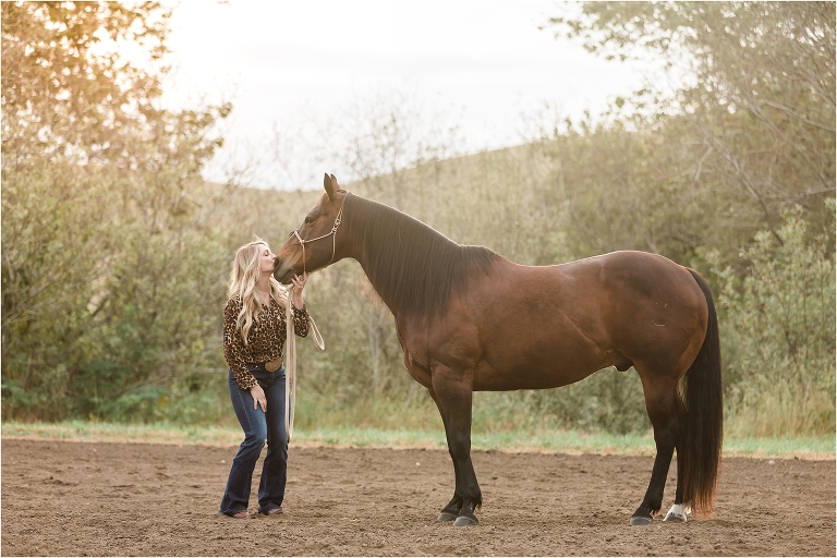 Woman kissing her horse's face during a Morro Bay Equine Photography session by Elizabeth Hay Photography