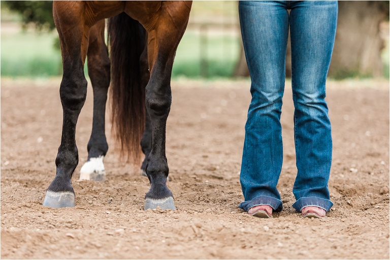 Horse hooves next to cowboy boots at a Morro Bay Equine Photography session with Elizabeth Hay Photography
