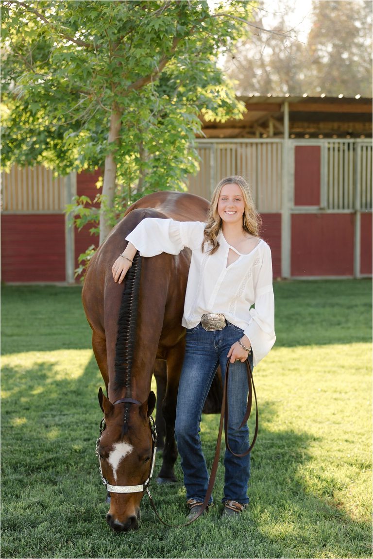 Bakersfield Equine Photography Session with California Equine Photographer Elizabeth Hay of blonde girl and horse grazing on grass.