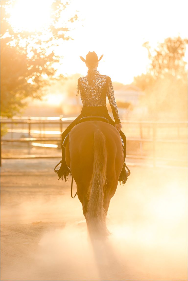Bakersfield Equine Photography Session with California Equine Photographer Elizabeth Hay of blonde girl and bay gelding riding into sunset. 