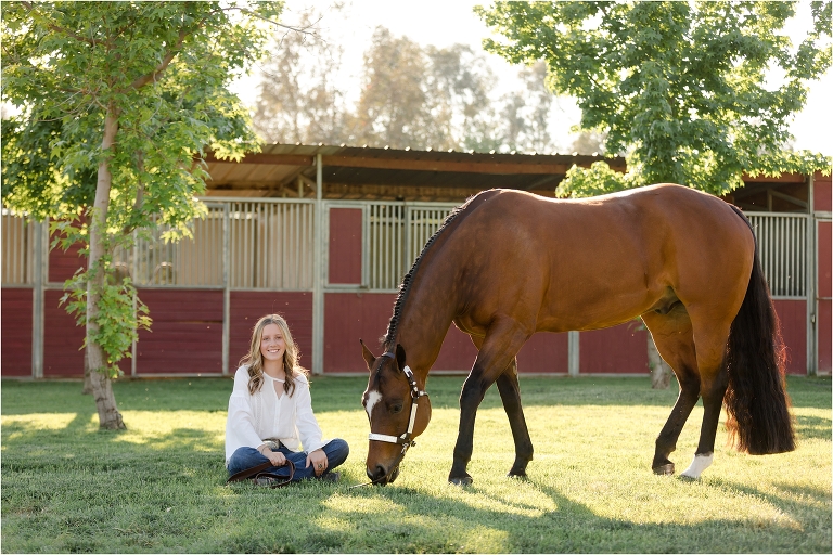 Bakersfield Equine Photography Session with California Equine Photographer Elizabeth Hay of blonde girl and bay gelding grazing on grass.