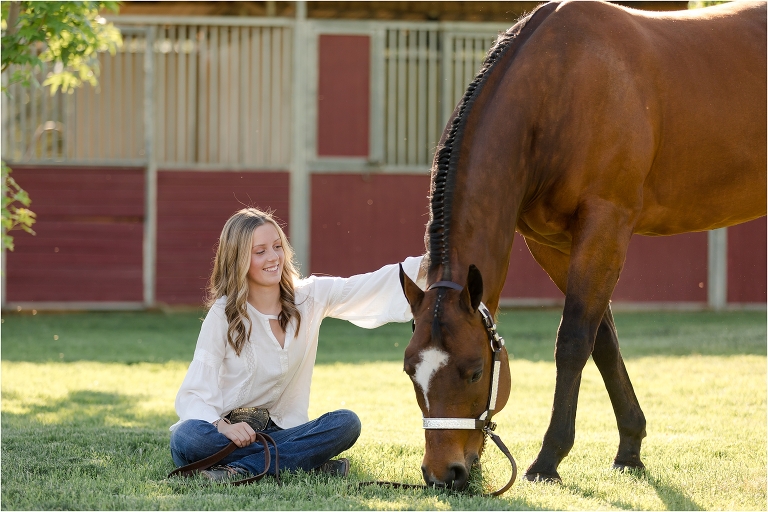 Bakersfield Equine Photography Session with California Equine Photographer Elizabeth Hay of blonde girl and bay horse grazing on grass.