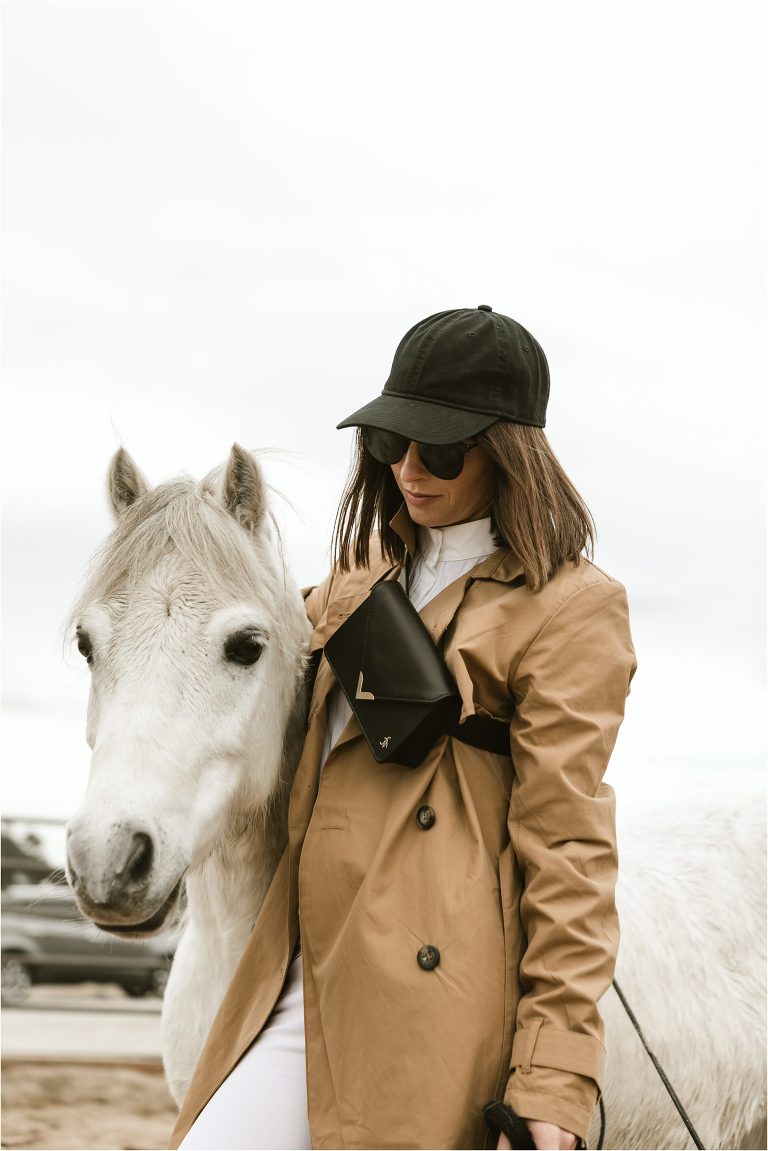Milton Menasco and grey pony wearing high fashion equestrian outfit.