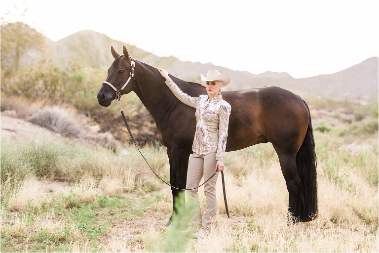 Equestrian and horse in an Arizona riverbed by Elizabeth Hay Photography