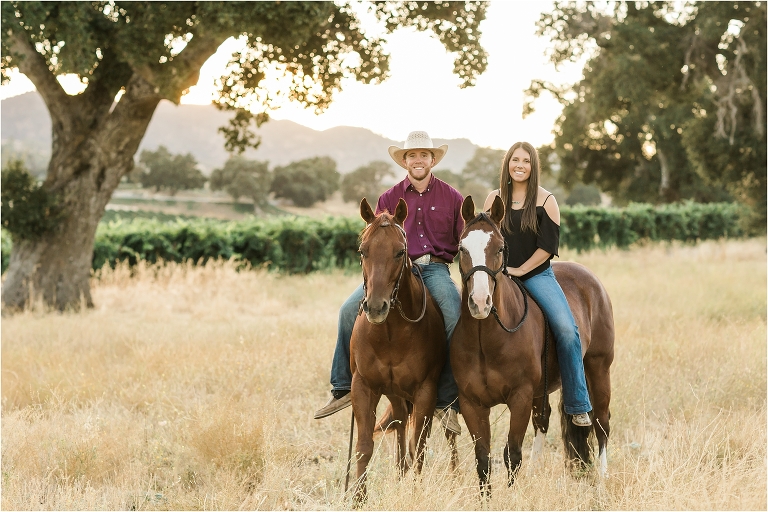 Cowboy and girl riding together by California Equine Photographer, Elizabeth Hay Photography.