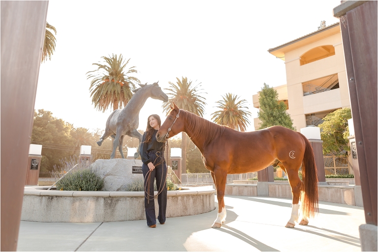 Cal Poly Senior Photography session by Cal Poly Mustang statue near the football field