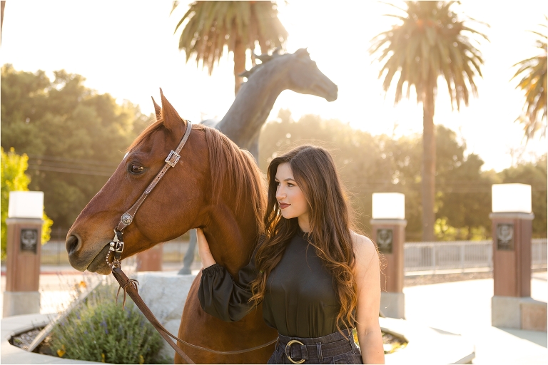 Cal Poly Senior Photography session by Cal Poly Mustang statue near the football field