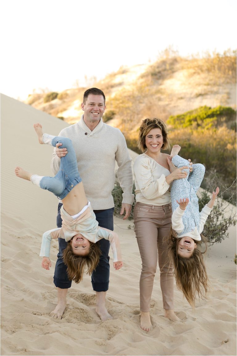 Pismo Beach Dunes Family Photography session by Elizabeth Hay Photography - parents holding kids upside down