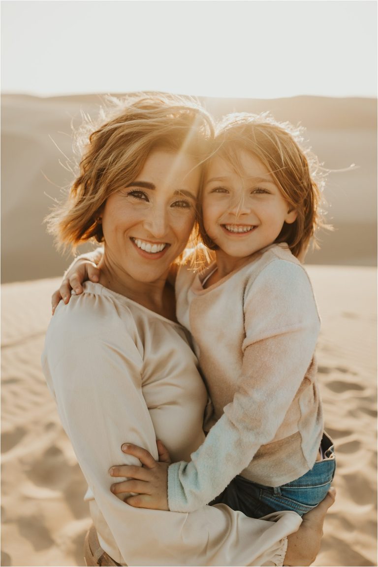child and mother at Pismo dunes by Elizabeth Hay Photography