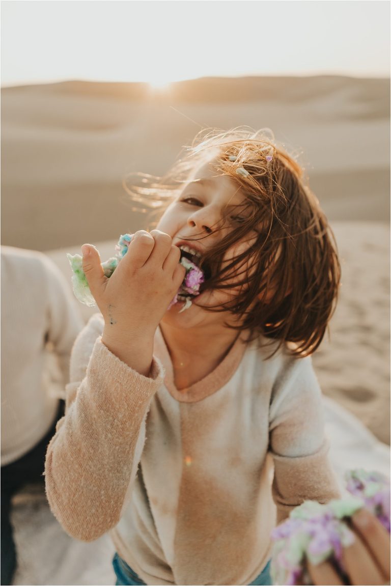 child eating cotton candy by Elizabeth Hay Photography