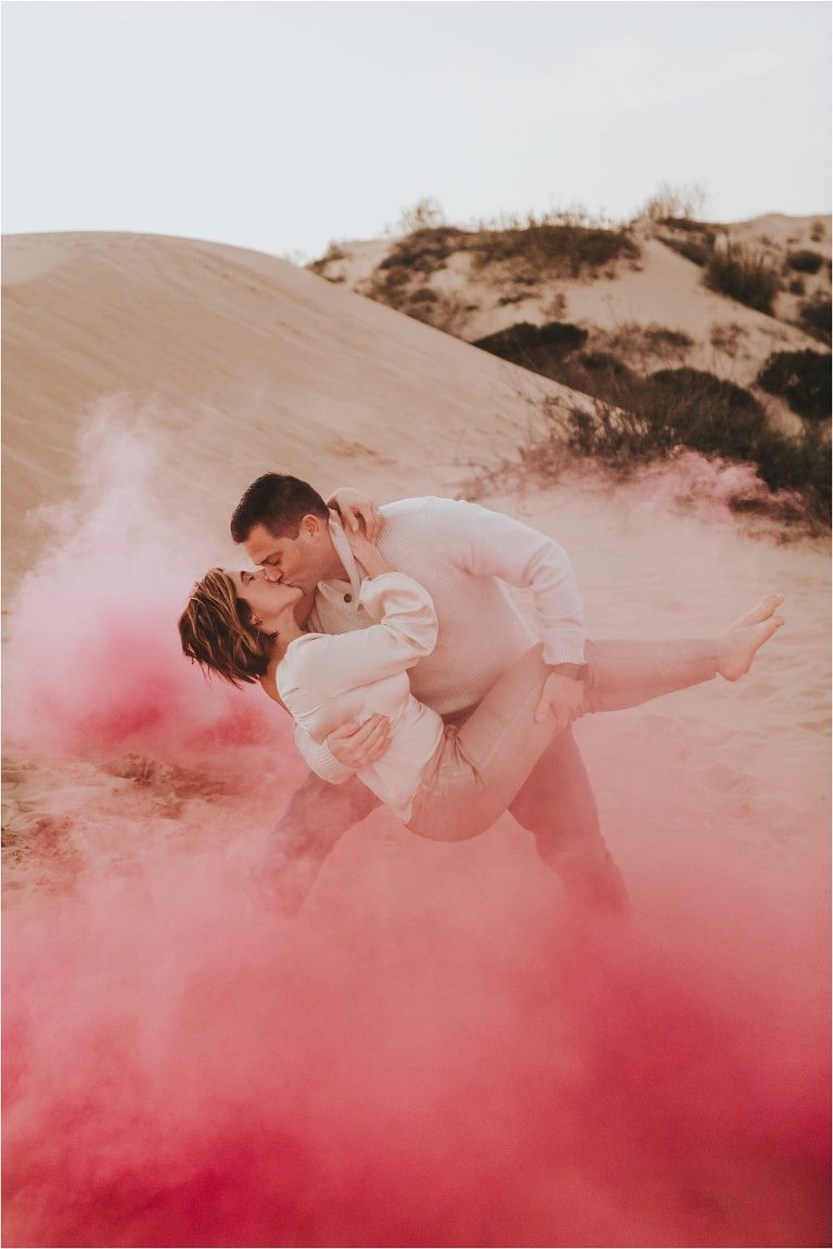 Pismo Beach Dunes couples session with hot pink smoke bomb by Elizabeth Hay Photography