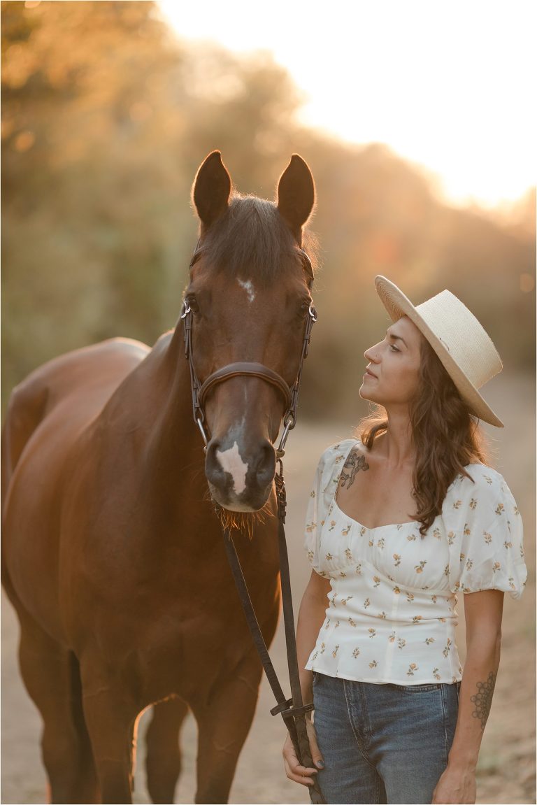Santa Barbara Equestrian Shoot with girl and her horse wearing a hat by the Salt Ranch Elizabeth Hay Photography