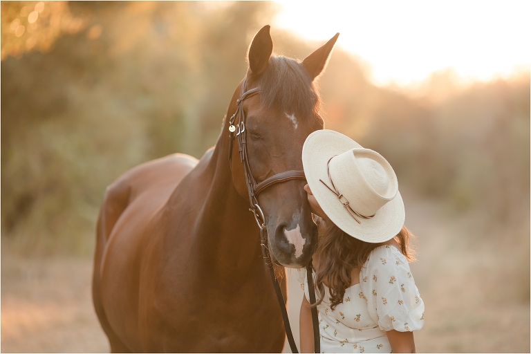 Smiling Teenage Girl Poses with Brown Horse at Sunset in Farm Field Stock  Photo - Alamy