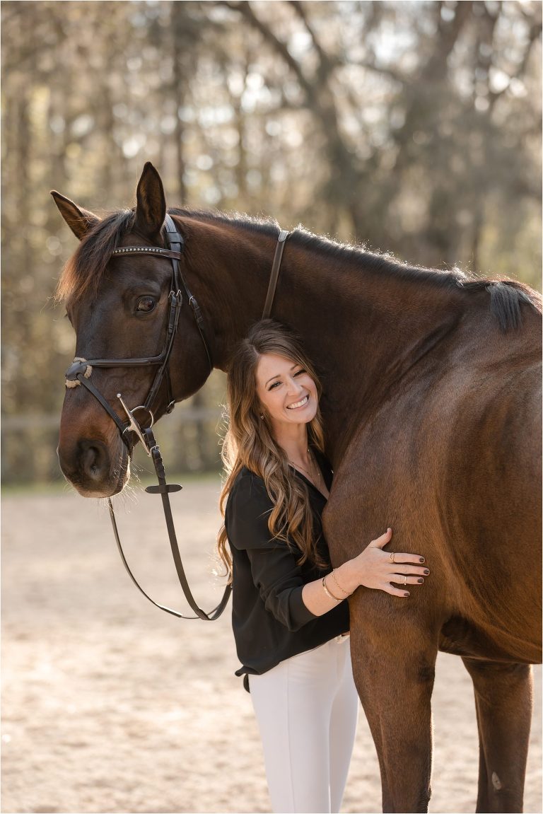 show jumper rider hugging her horse in Ocala Florida by California Equine Photographer Elizabeth Hay Photography