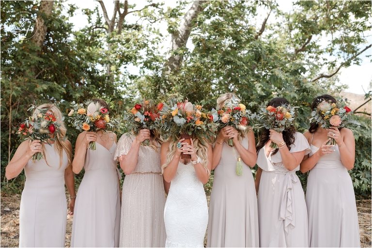 western bride and bridesmaids before Morro Bay Ranch wedding by Elizabeth Hay Photography with bridal bouquets