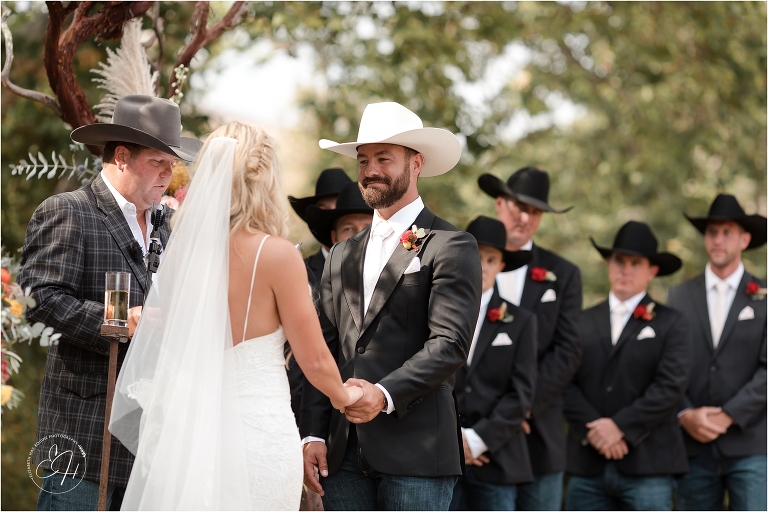 groom smiling at bride at Morro Bay Ranch wedding by Elizabeth Hay Photography
