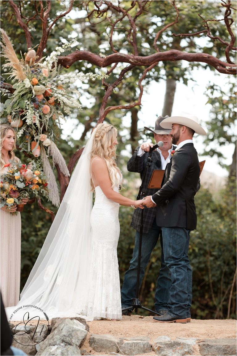 bride and groom exchanging vows at Morro Bay Ranch wedding by Elizabeth Hay Photography