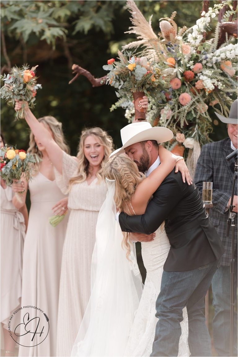bride and groom first kiss at Morro Bay Ranch wedding by Elizabeth Hay Photography