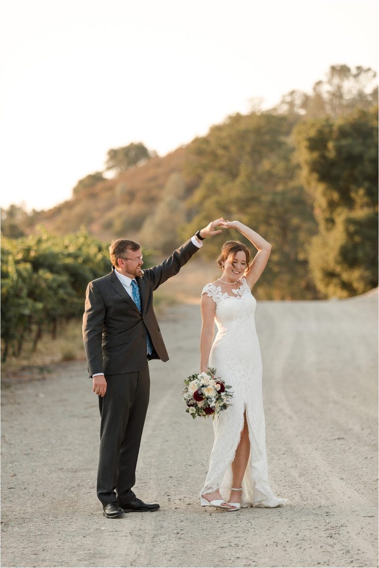 couple dances through a vineyard Oyster Ridge Elopement wedding at a California Winery