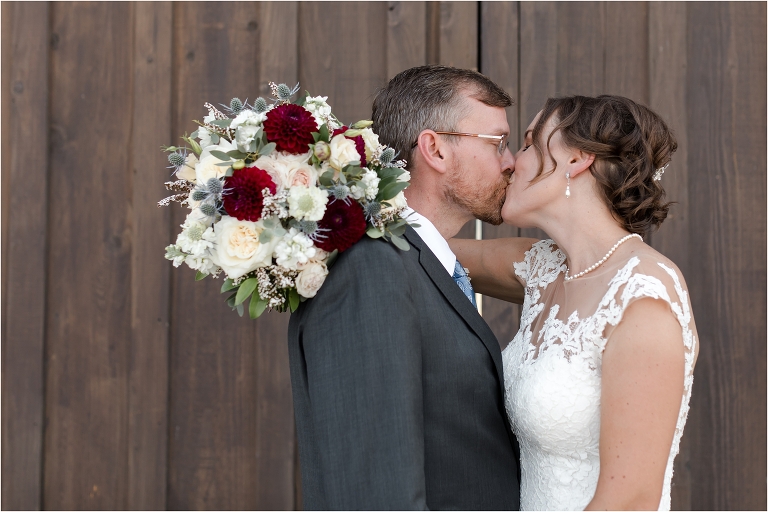 bride and groom kiss at an Oyster Ridge Elopement wedding at a California Winery