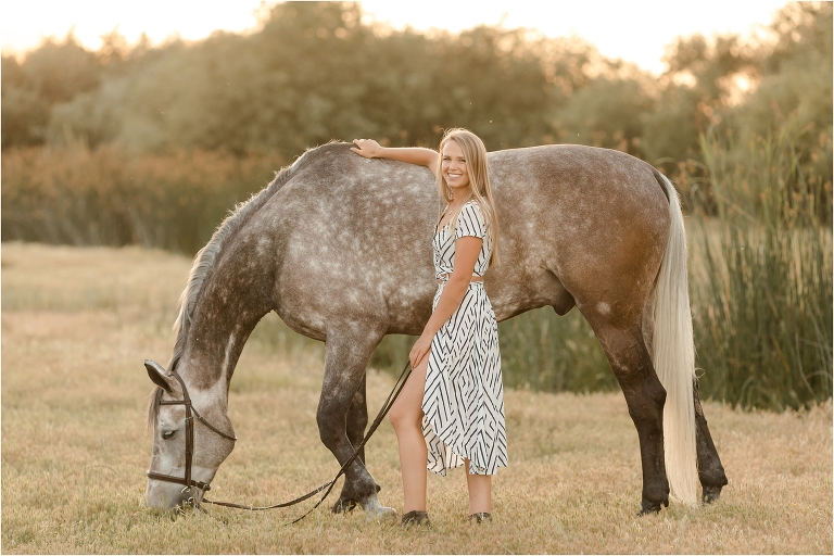California Equine Photographer image of blonde girl and grey horse by Elizabeth Hay Photography .