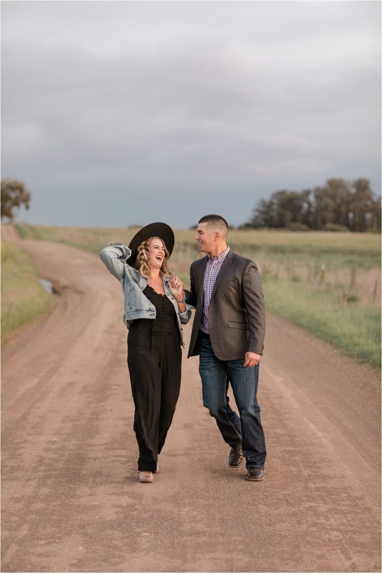 couple laughing during Western Engagement session by Elizabeth Hay Photography