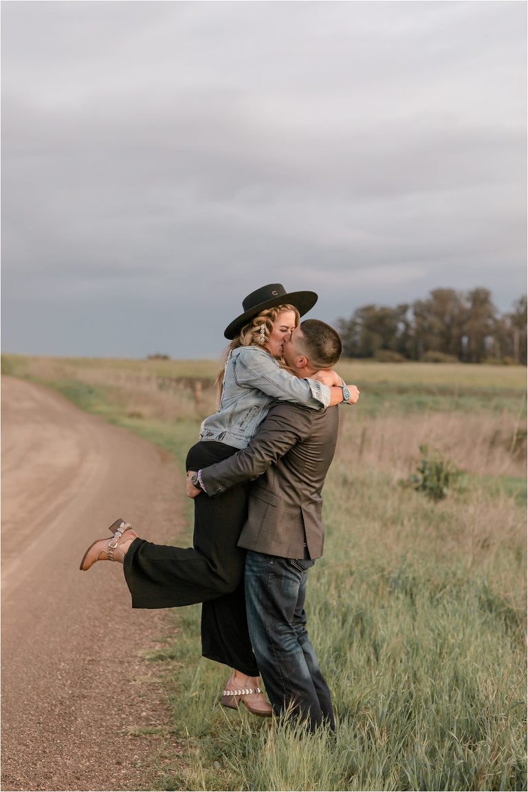 couple kissing during Western Engagement session by Elizabeth Hay Photography