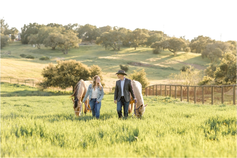 Western Engagement session with horses in a pasture by Elizabeth Hay Photography