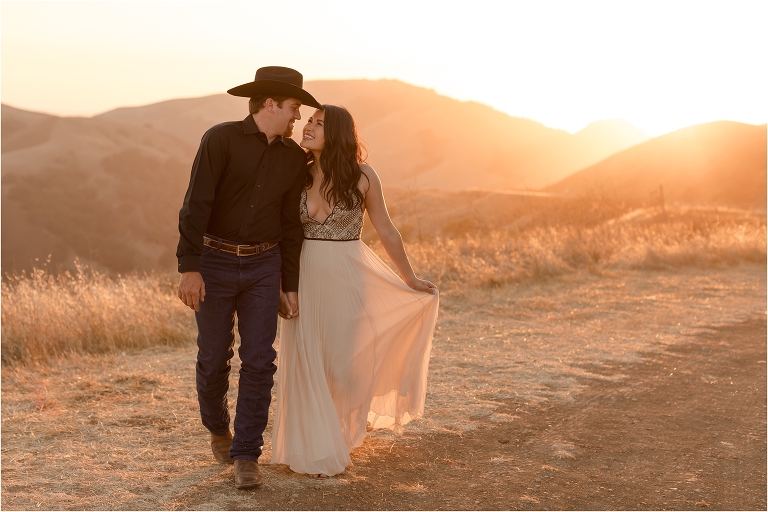 Western Engagement session on Highway 46 west by Elizabeth Hay Photography with Becky and Mo walking. 