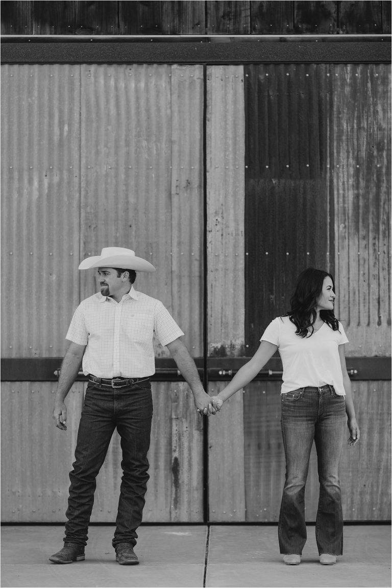 western Paso Robles Engagement session at Epoch Estate Wines by Elizabeth Hay Photography with Becky and Mo in front of barn.