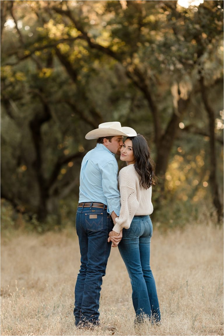Paso Robles Engagement session at Epoch Estate Wines by Elizabeth Hay Photography with Becky and Mo kissing. 