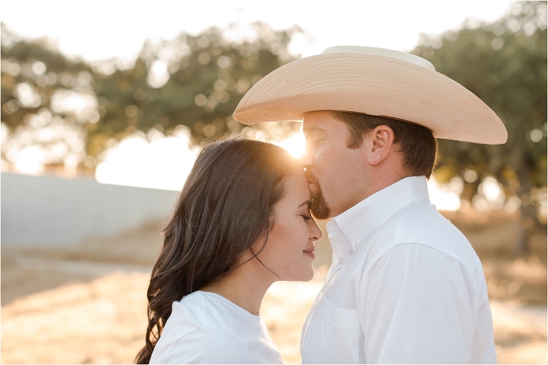 Paso Robles Engagement session at Epoch Estate Wines by Elizabeth Hay Photography with Becky and Mo kissing at sunset.
