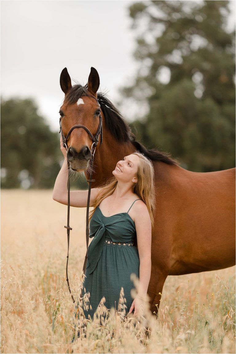 Cal Poly Equestrian Senior session with a girl and her horse in a vineyard by California Equine Photographer Elizabeth Hay Photography.