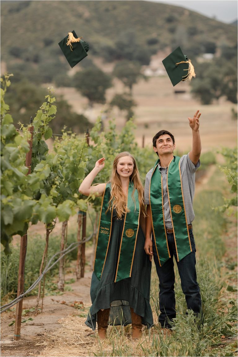 Cal Poly Seniors tossing their graduation caps in a California vineyard by Elizabeth Hay Photography.