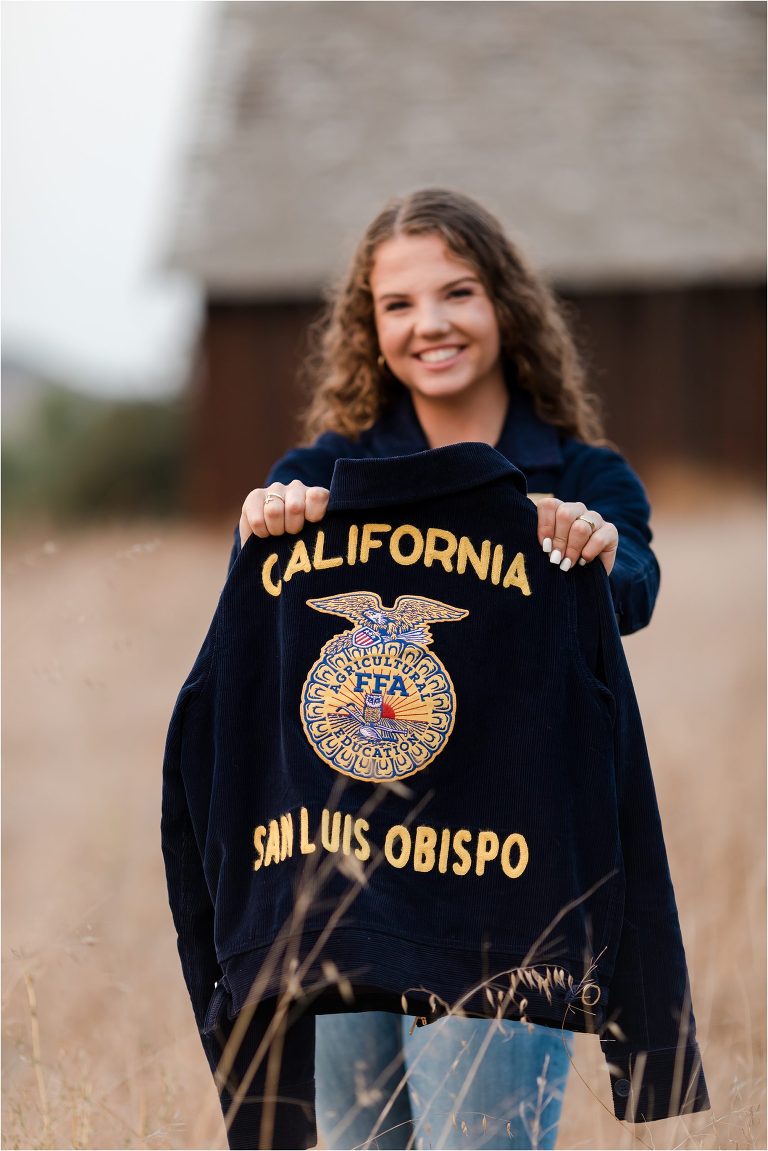 Graduating senior and her high school FFA jacket by Elizabeth Hay Photography. 