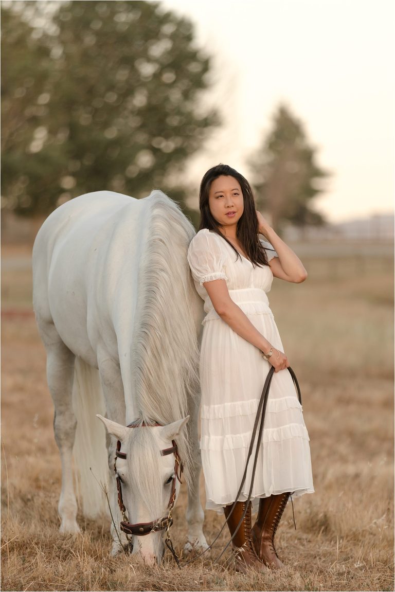 woman standing with her white Lusitano gelding by California Equine Photographer Elizabeth Hay Photography