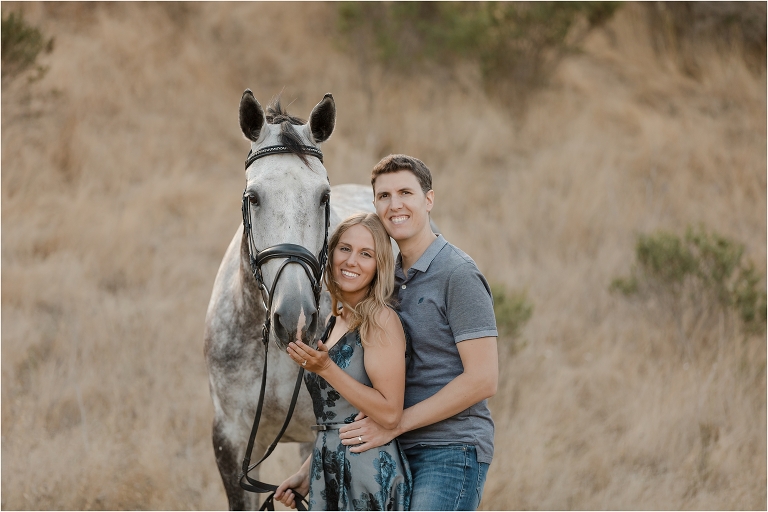 grey horse, husband and wife at a Shiloh West Eventing Session by California Equine Photographer Elizabeth Hay Photography.
